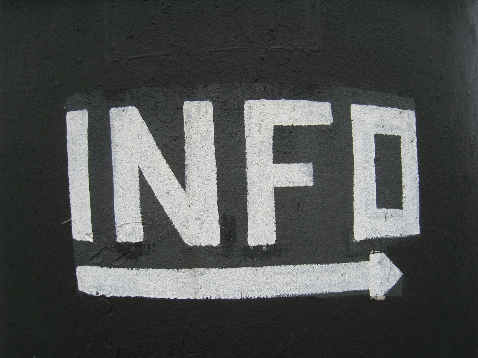 Photo by Giulia May Info arrow signage